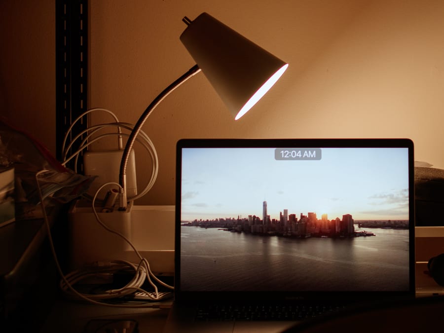 laptop on desk with lamp
