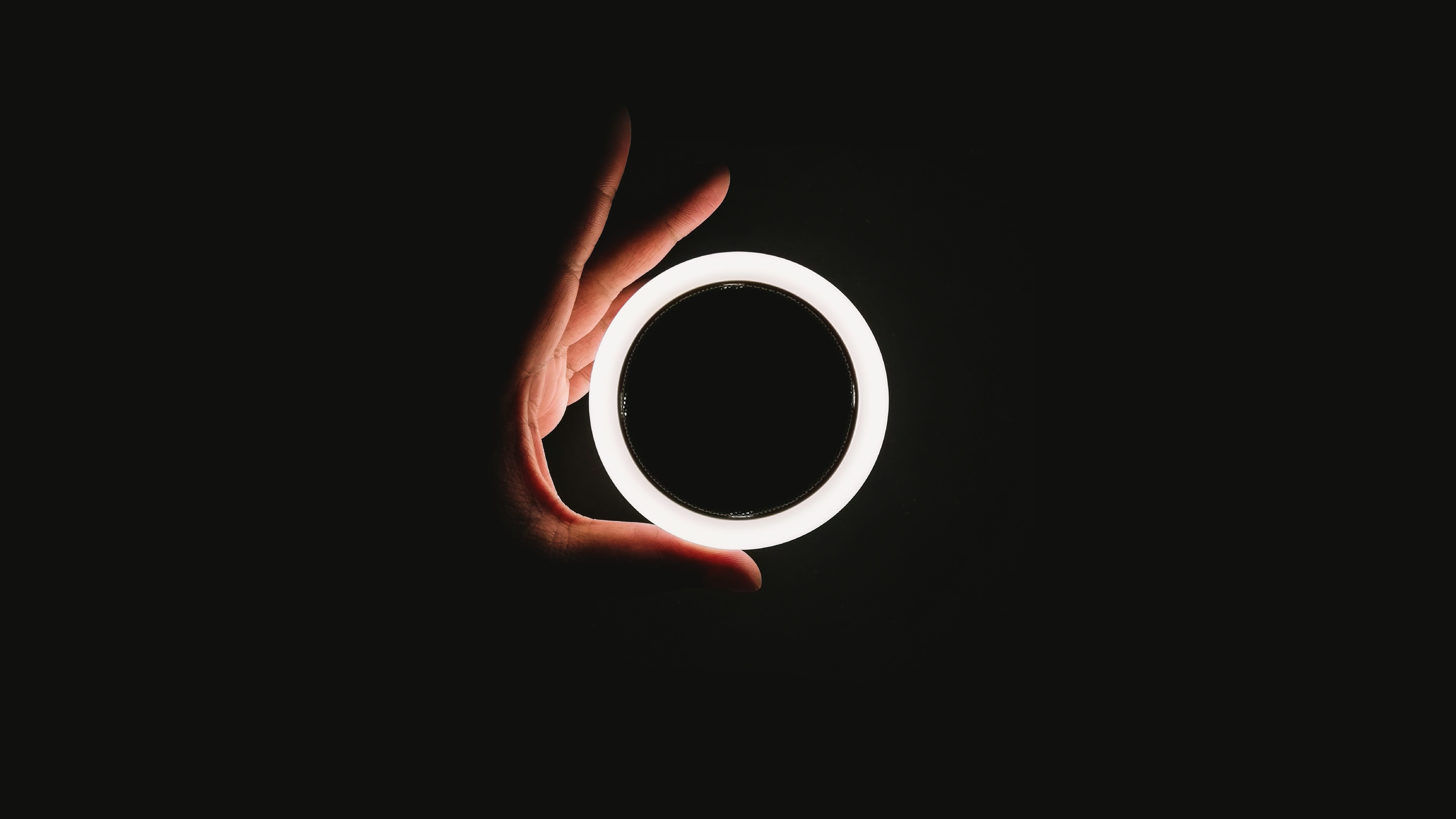 hand holding ring light