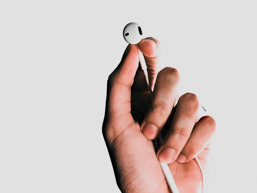 hand holding earbud